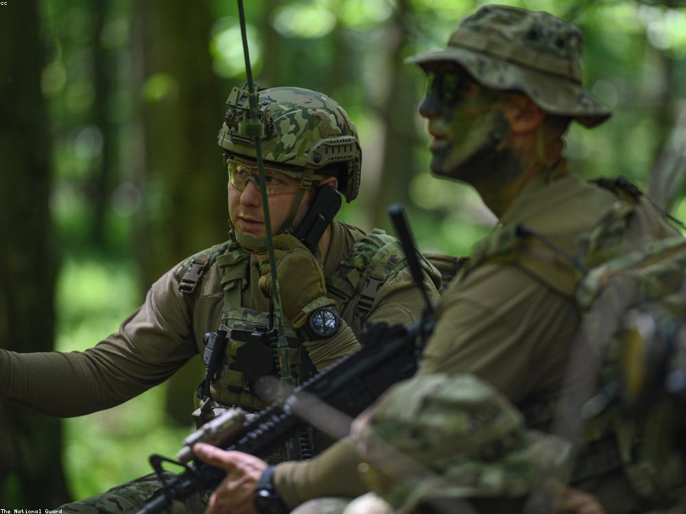 Military personnel equipped with tactical ballistic protection